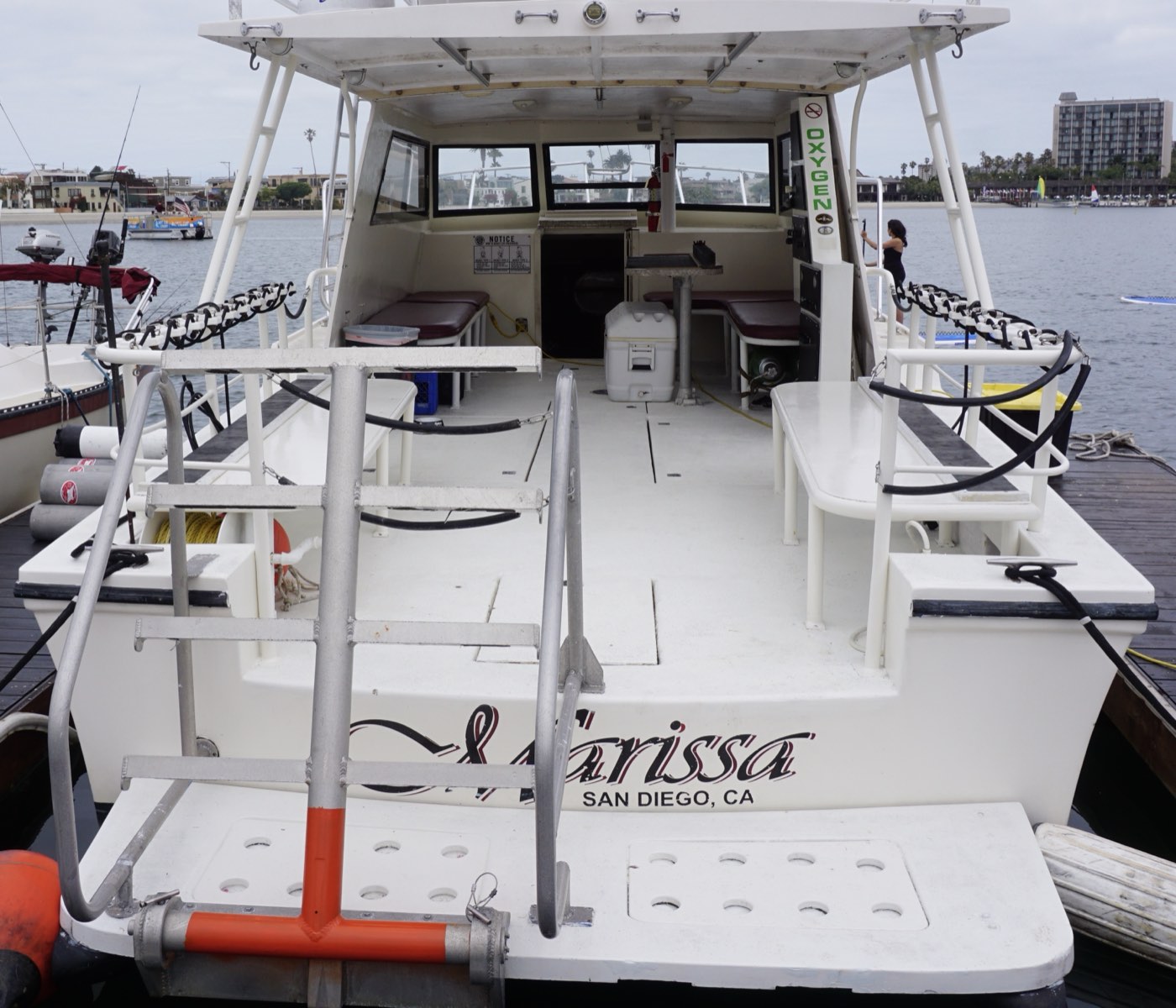 The Marissa's open stern deck with bins along both rails and the swim step